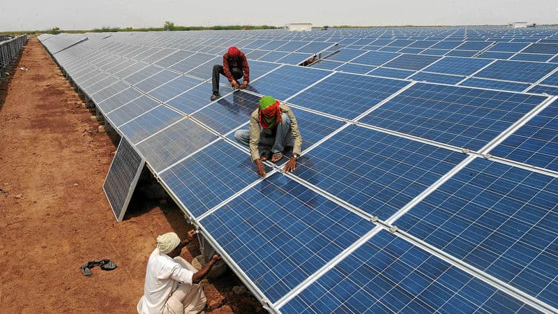 Solar panels paired with modern battery energy storage units